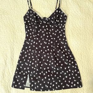 Black floral mini dress with slit and lace trim